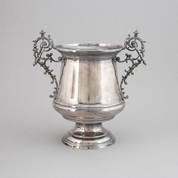 A silver plated winecooler.