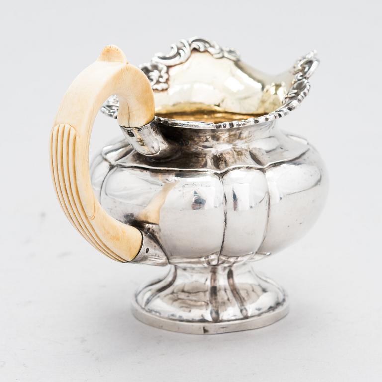 A Russian silver cream jug, Moscow, 1825-29. Unidentified maker's mark. Assay master Nikolay Dubrovin.