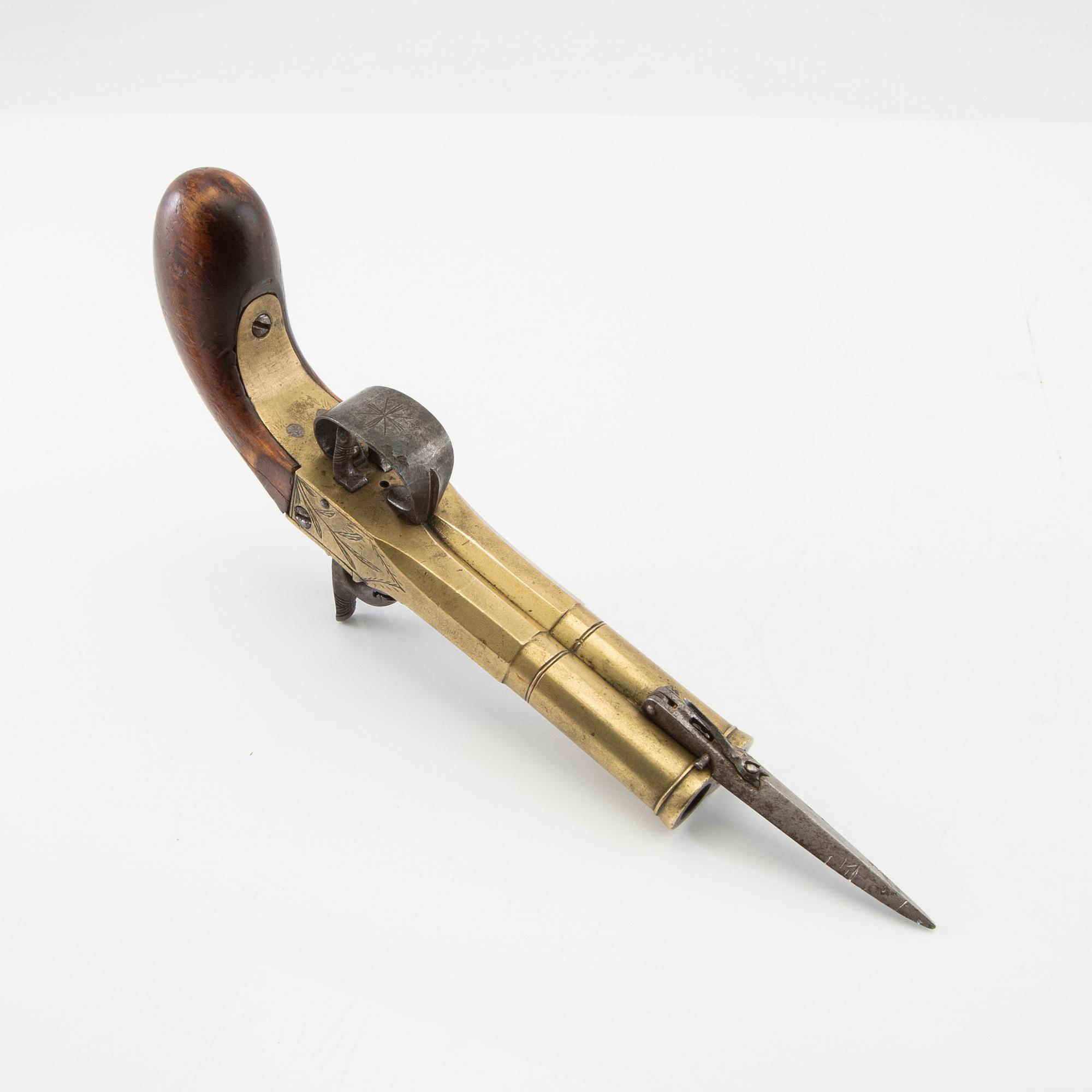 Double-barrel percussion pistol with bayonet, 19th century.