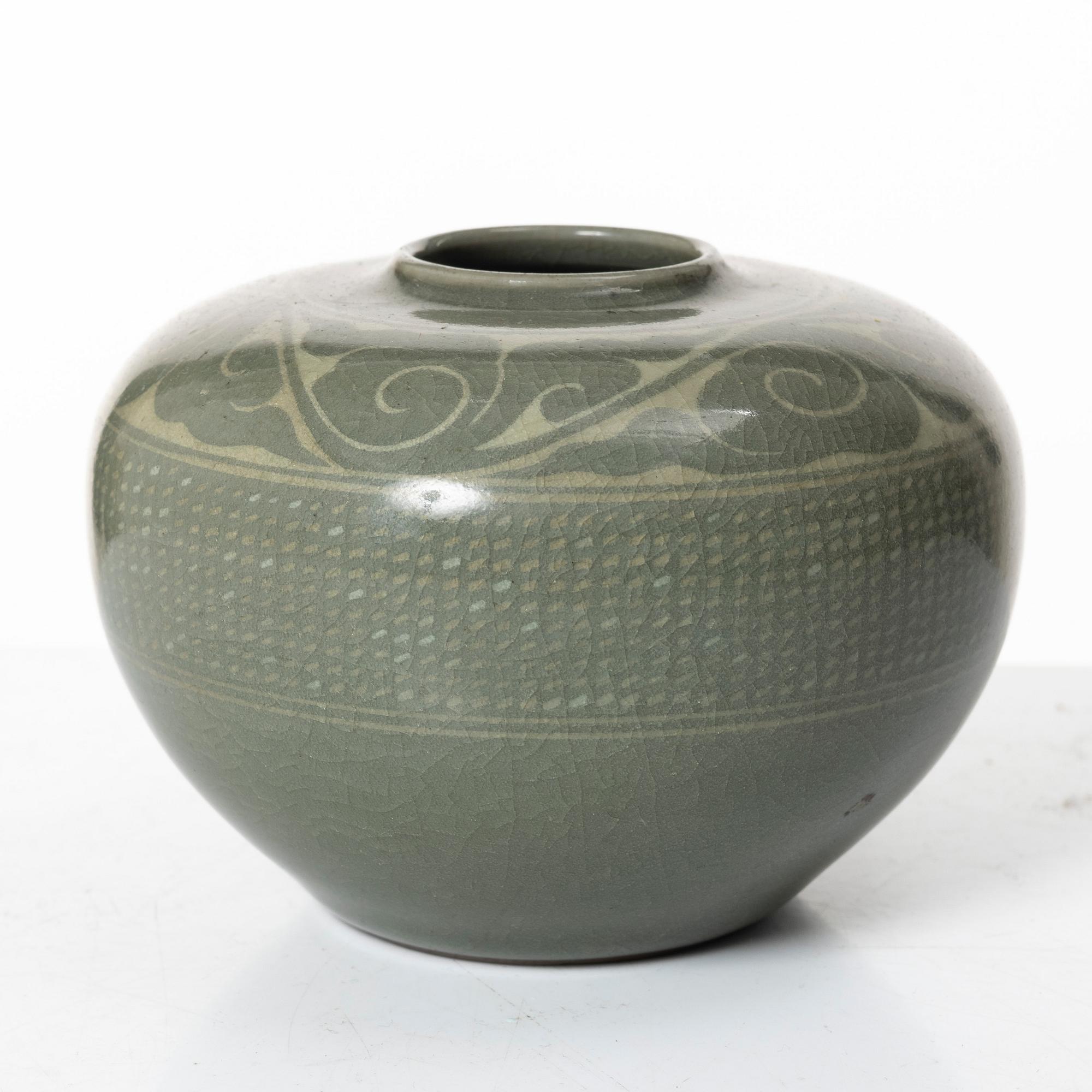 A Korean celadon glazed ceramic vase, 1900s.