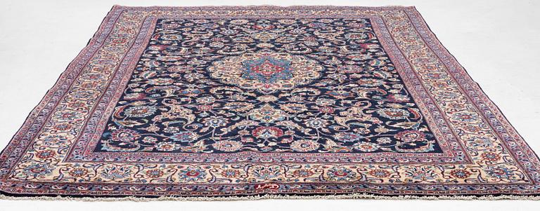 A Persian carpet, signed, c. 339 x 247 cm.