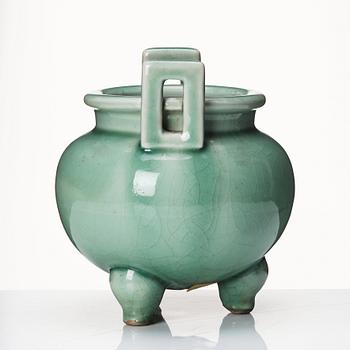 A celadon tripod censer. Qing dynasty (1664-1912).