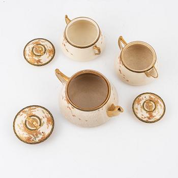 A box with a Japanese satsuma tea service, signed, early late Meiji (1868-1912). (15 pieces).