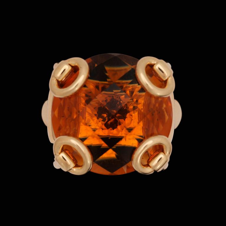 A Gucci ring with checker-cut citrine.