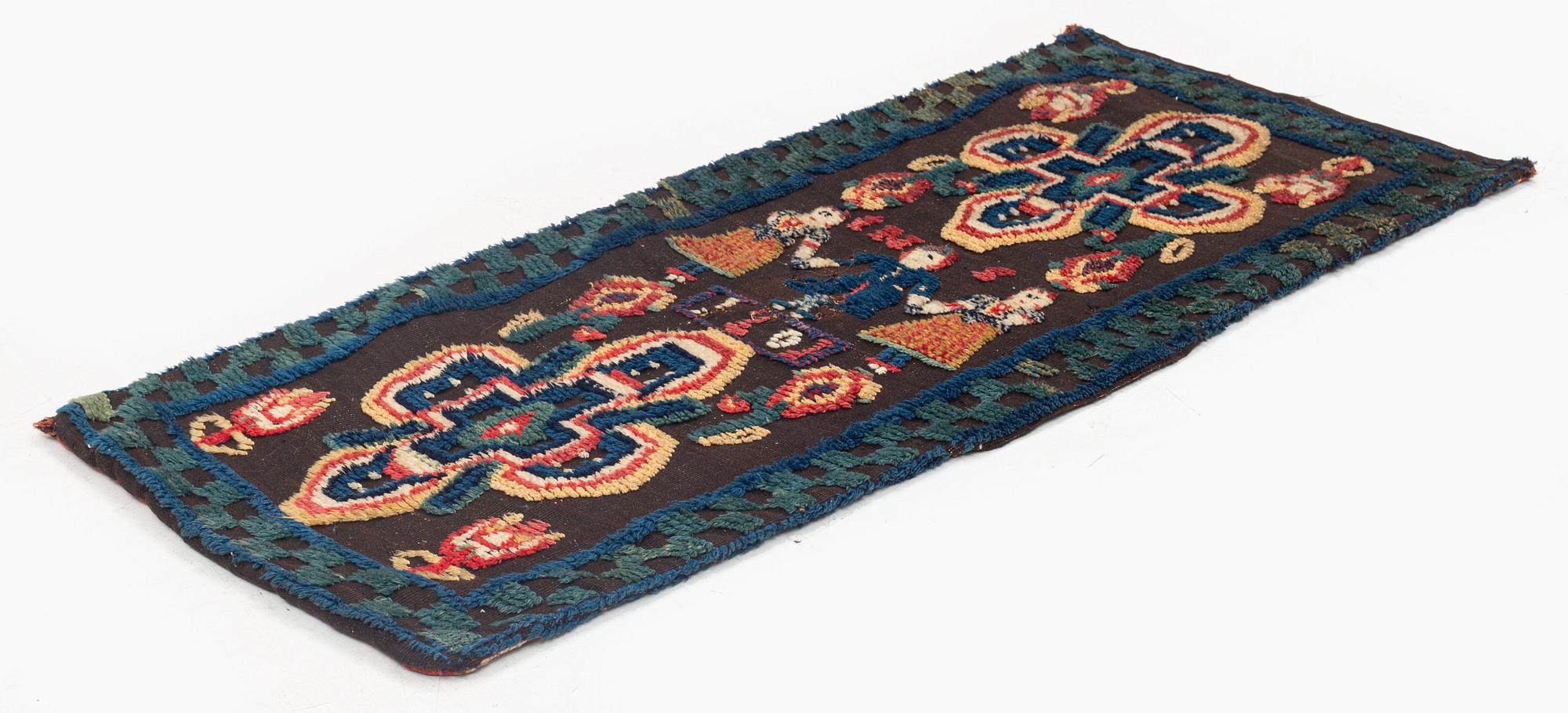 A carrige cushion, knotted pile in relief, c. 104 x 48 cm, probably Skytts district dated 1801.