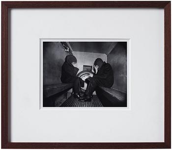 Weegee, "Charles Sodokoff and Arthur Webber using their top hats to hider their faces, New York, January 26 1942".