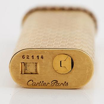 A cigarette lighter by Cartier set with single cut diamonds.