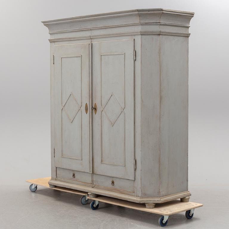 A mid 19th century painted wardrobe.