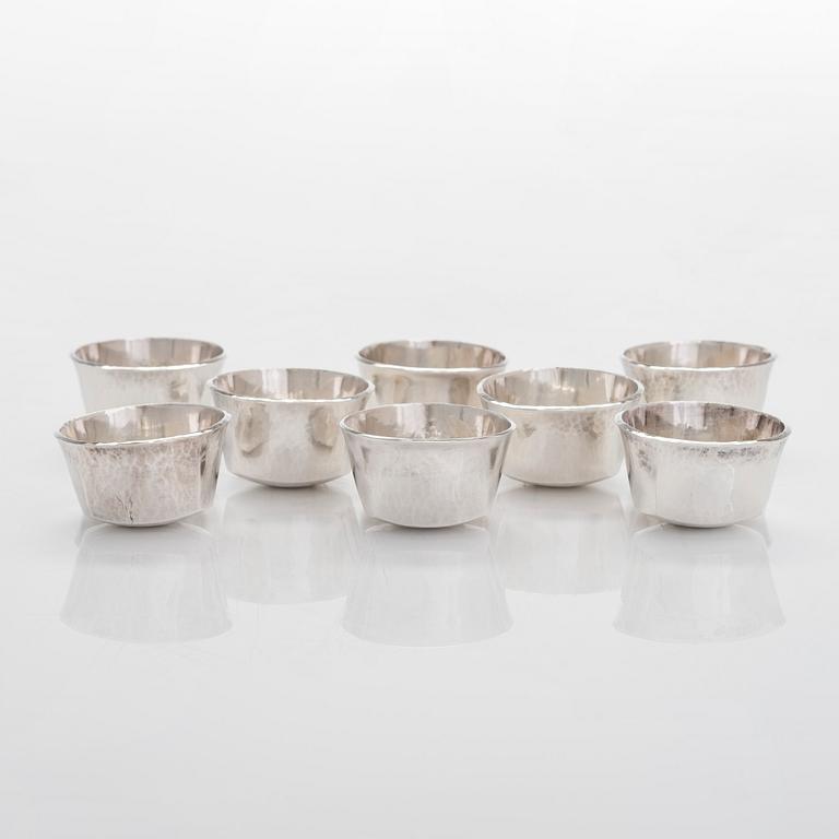 A set of eight sterling silver tumblers, maker's mark of Jan Lundgren, Stockholm 1981.