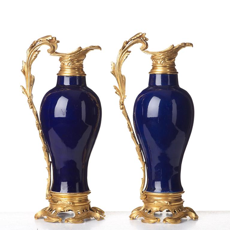 A pair of gilt bronze mounted vases, Qing dynasty, Qianlong (1736-95). French bronze mounts.