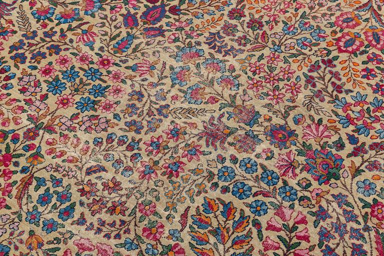 An antique 'Millefleur' Kerman Laver carpet, ca 434 x 321 cm.