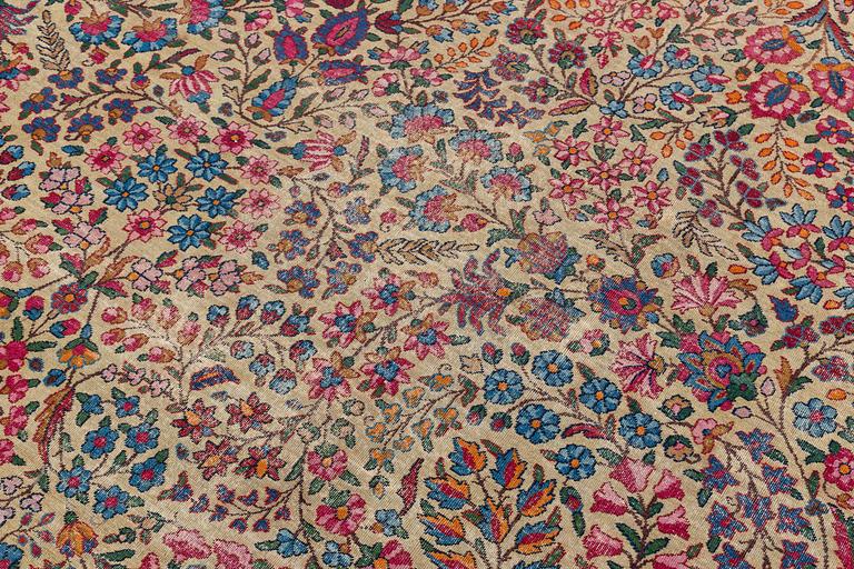 An antique 'Millefleur' Kerman Laver carpet, ca 434 x 321 cm.