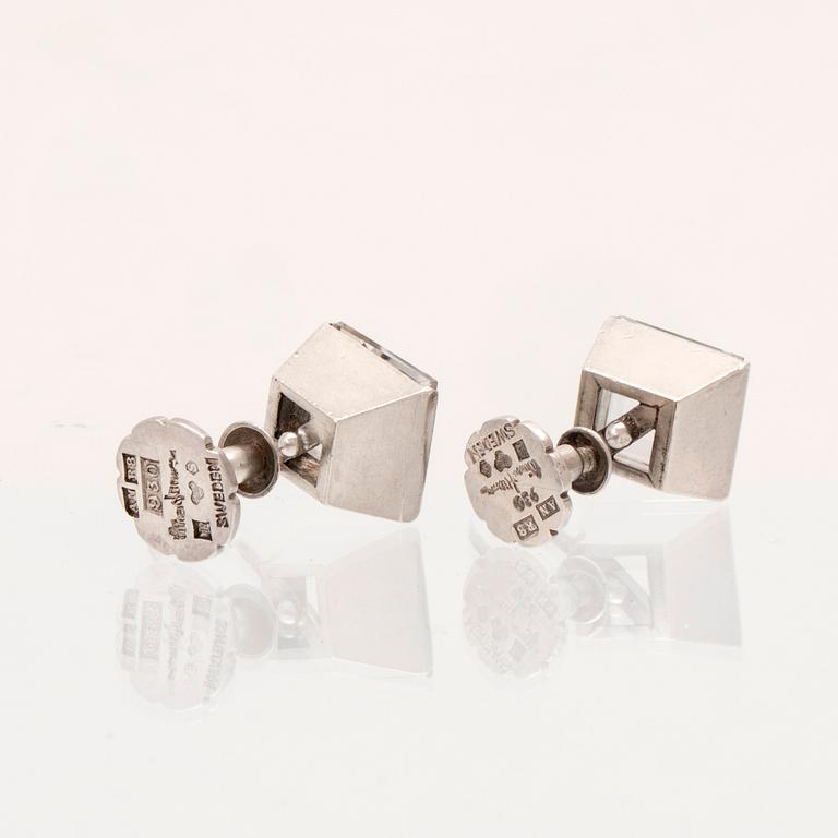 A pair of silver earrings set with step-cut rock quartz crystal by Wiwen Nilsson, Lund 1943.