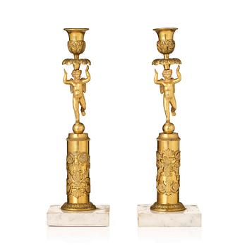 148. A pair of late Gustavian marble and omrolu candlesticks, late 18th century.