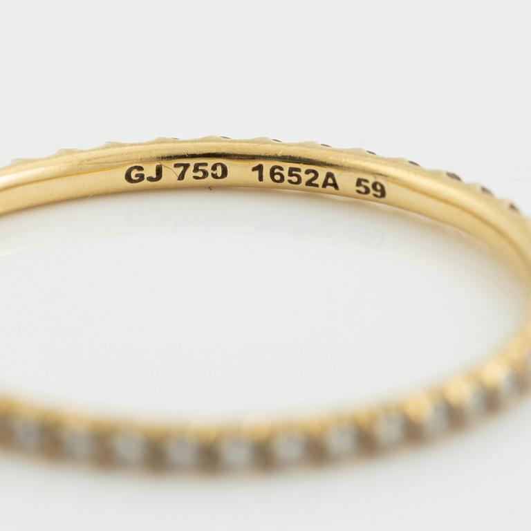 Ringar, Georg Jensen. ett par, "Signature", 18K guld med briljantslipade diamanter.