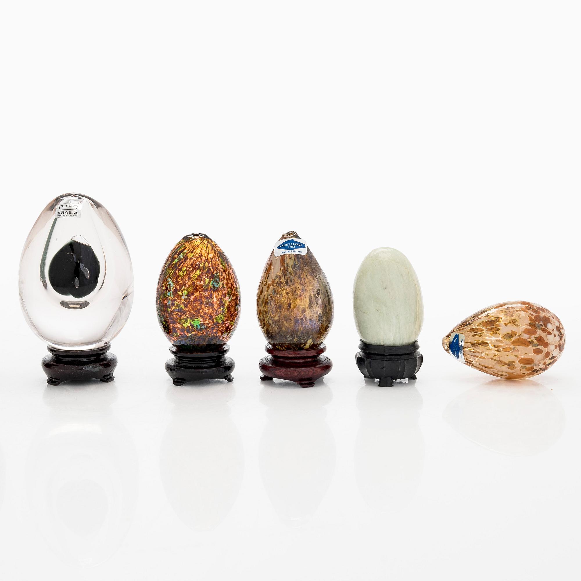 A set of 10 glass and stone decorative eggs.