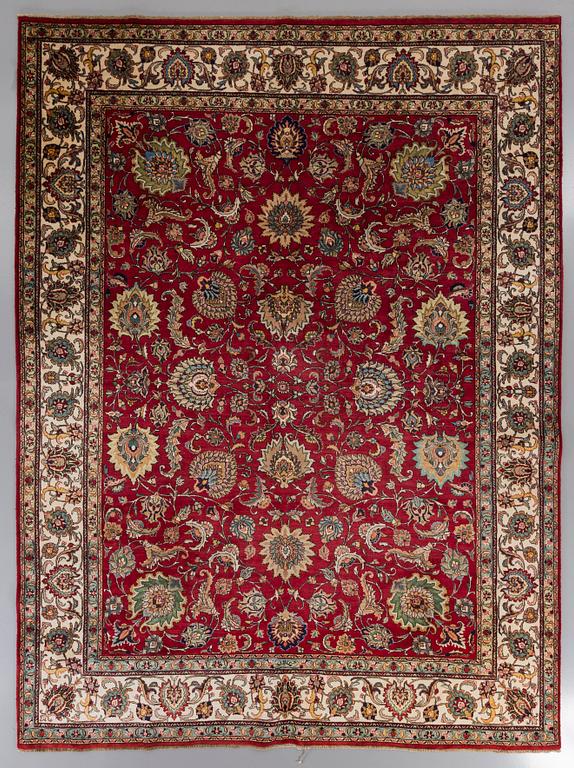 An old Tabriz carpet ca 400 x 300 cm.