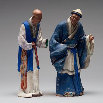 Two clay figures of chinese men, Qing dynasty, 19th Century.