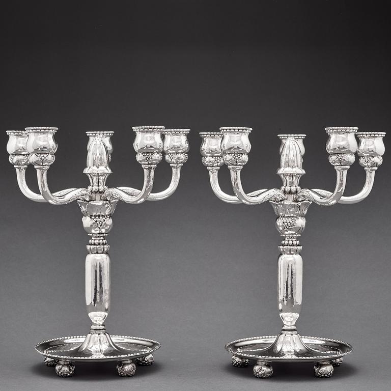 Georg Jensen, a pair of 830/1000 silver five light candelabra, Copenhagen 1920, design nr 200.