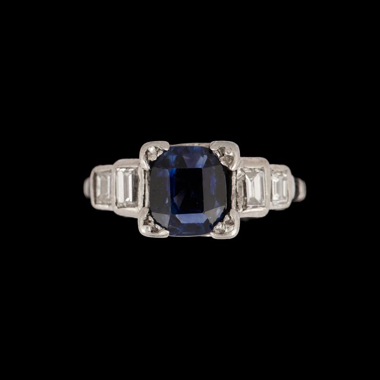 A sapphire and baguette cut diamond ring.