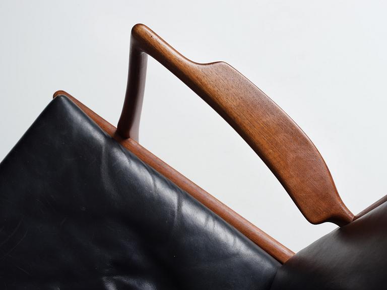 Hans J. Wegner, a pair of "AP16" teak and black leather armchairs, AP-stolen, Denmark 1950-60´s.