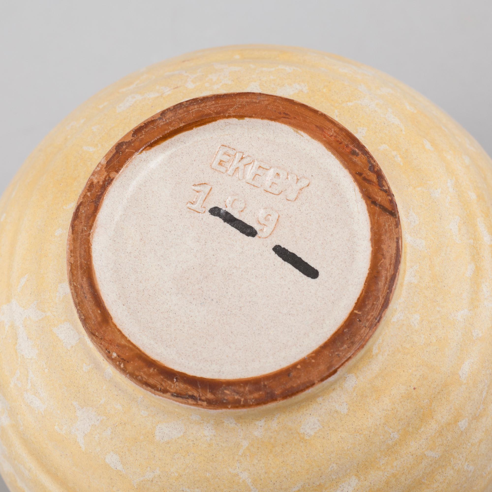 Three vases and on Upsala Ekeby, mid 20th century.