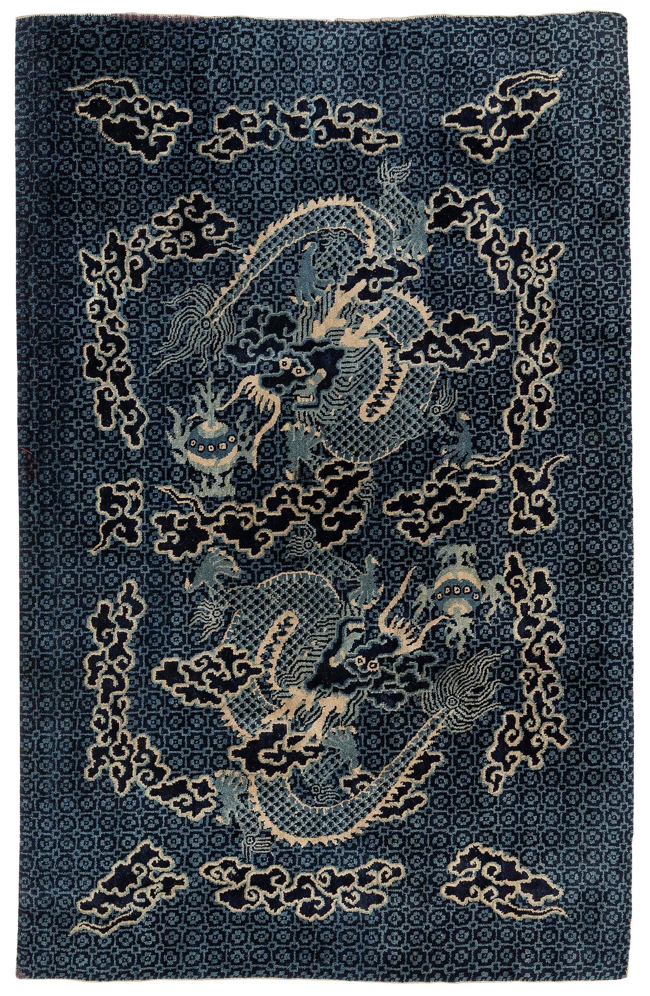 A Chinese 'dragon' rug, circa 1920. (c 190x122 cm).