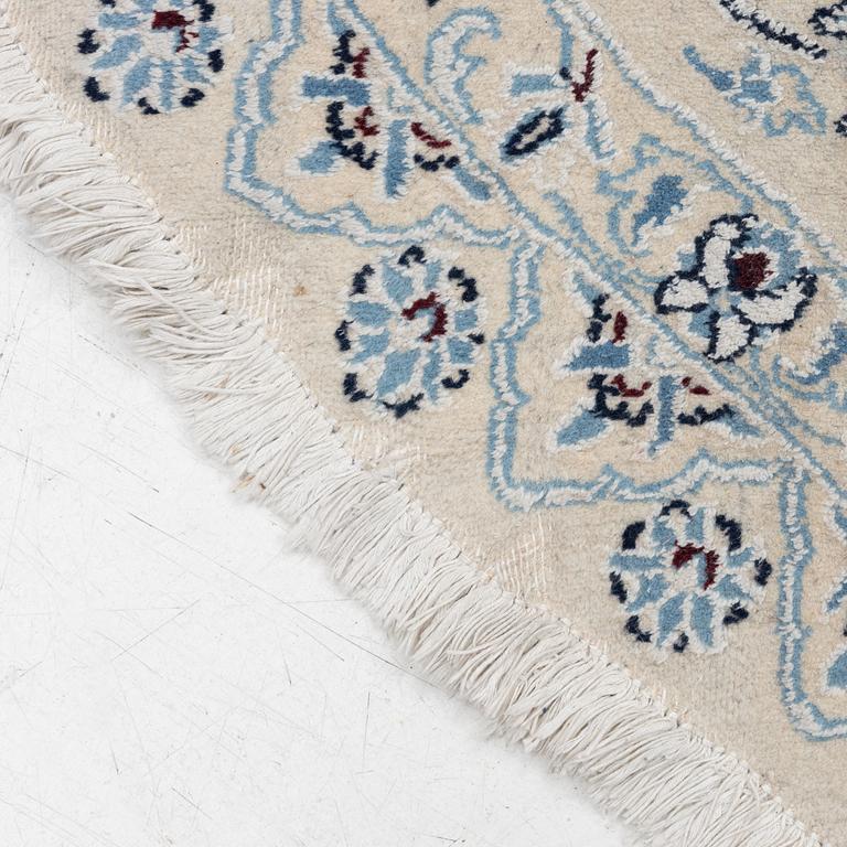 A Nain rug, diameter 243 cm.