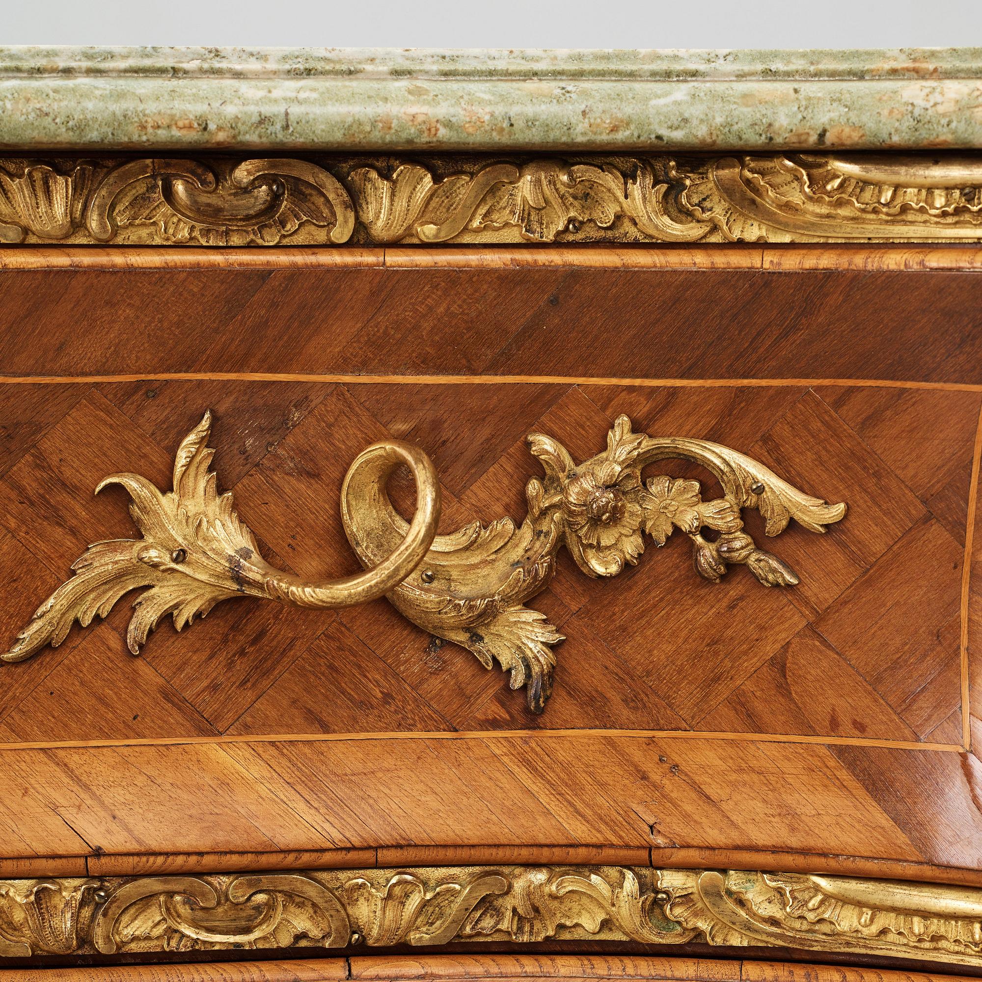 A Swedish Rococo chest of drawers by Christian Linning dated 1761 (master in Stockholm 1744-1779).