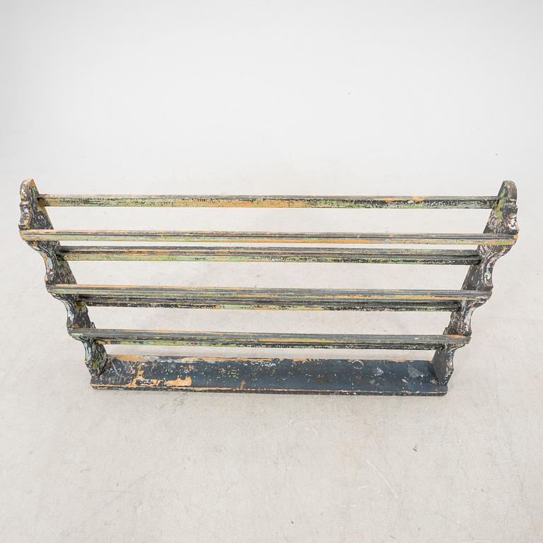 A painted early 1900s shelf.
