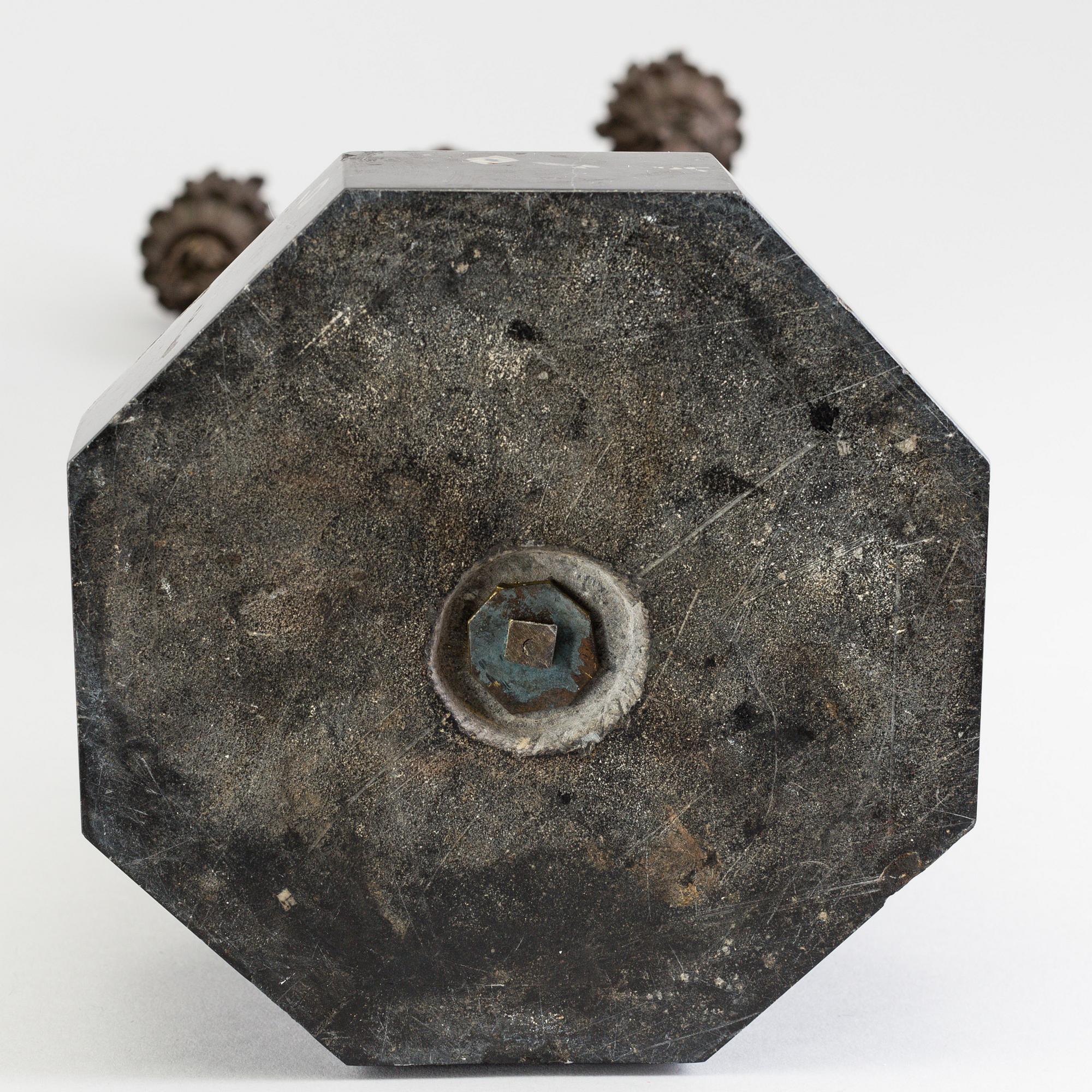 A pair of late 19th century patinated brass candelabra.