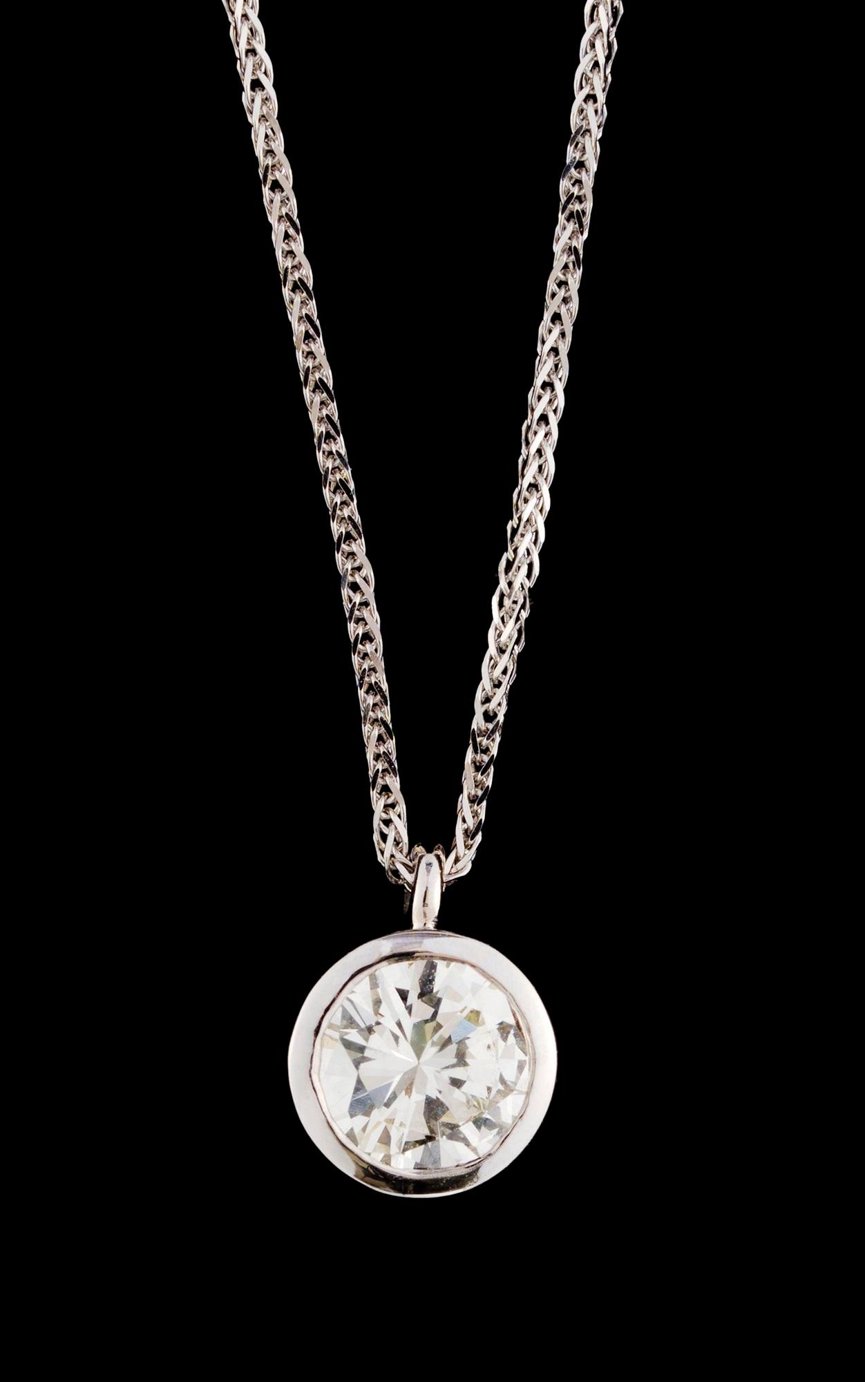 A gold and diamond pendant.