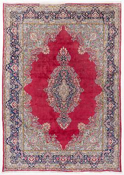 A Kirman carpet, signed, c. 388 x 279 cm.