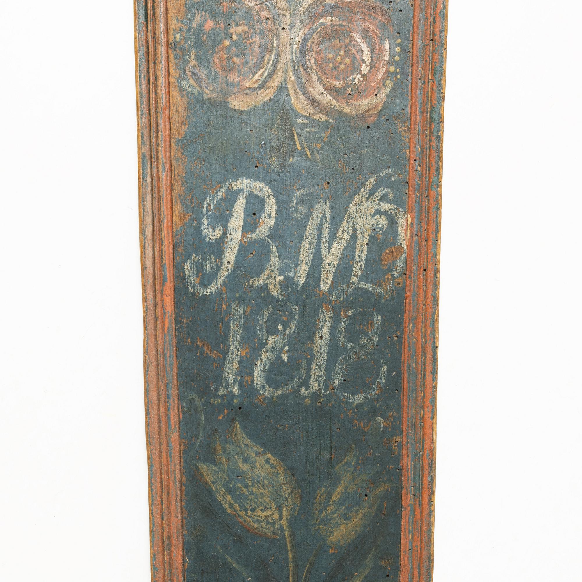 A painted wooden mangle board, Southern Sweden, dated 1818.