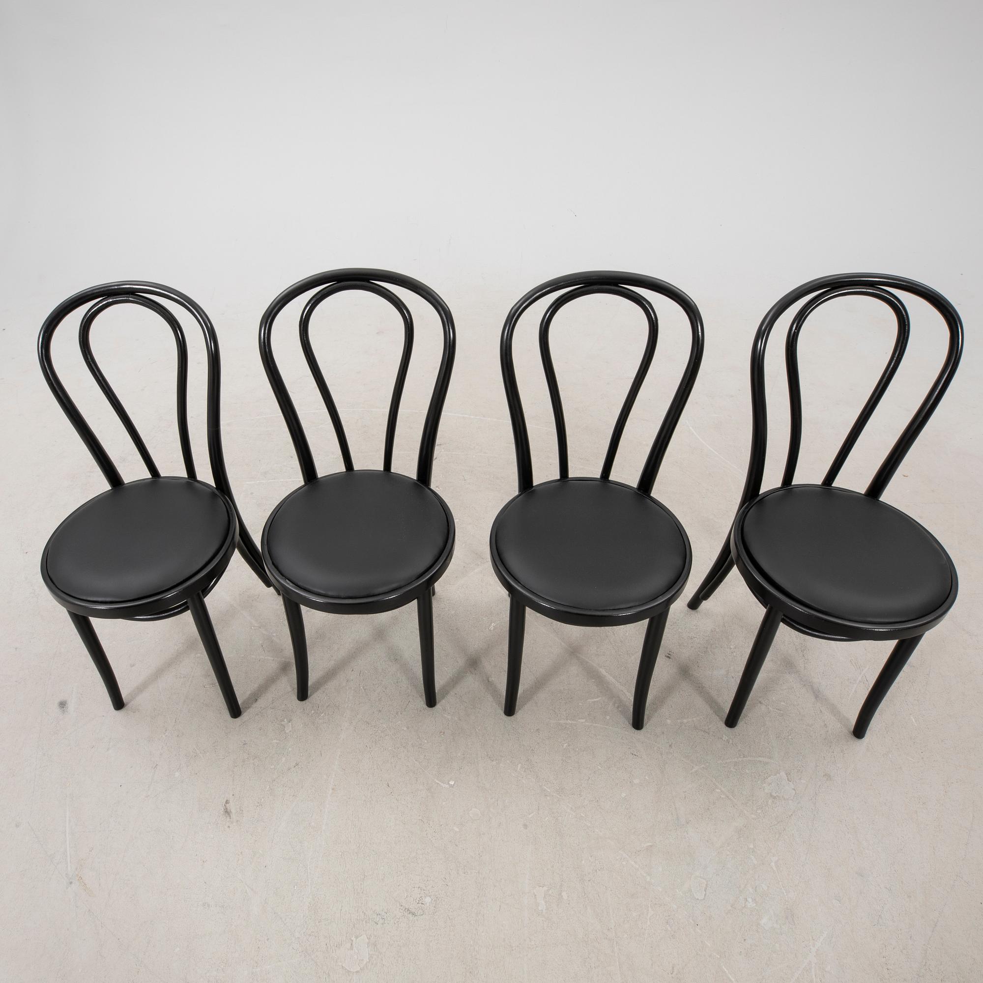 A swt of four painted chairs later part of the 20th century.