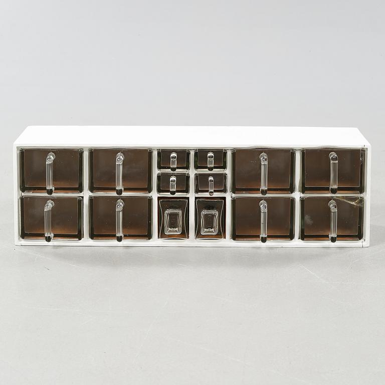 A spice rack from around the middle of the 20th century.