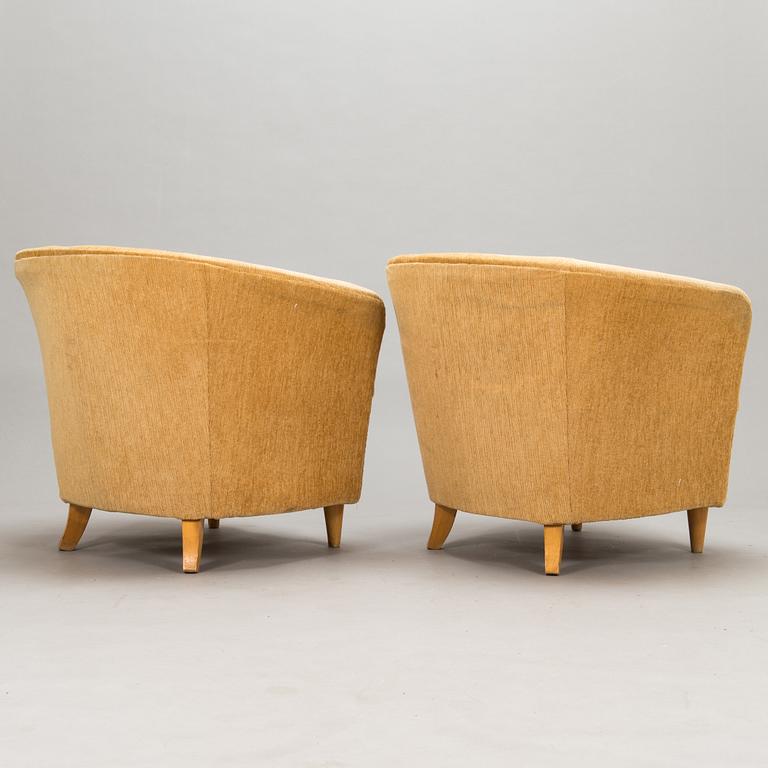 A pair of 1950's armchairs.