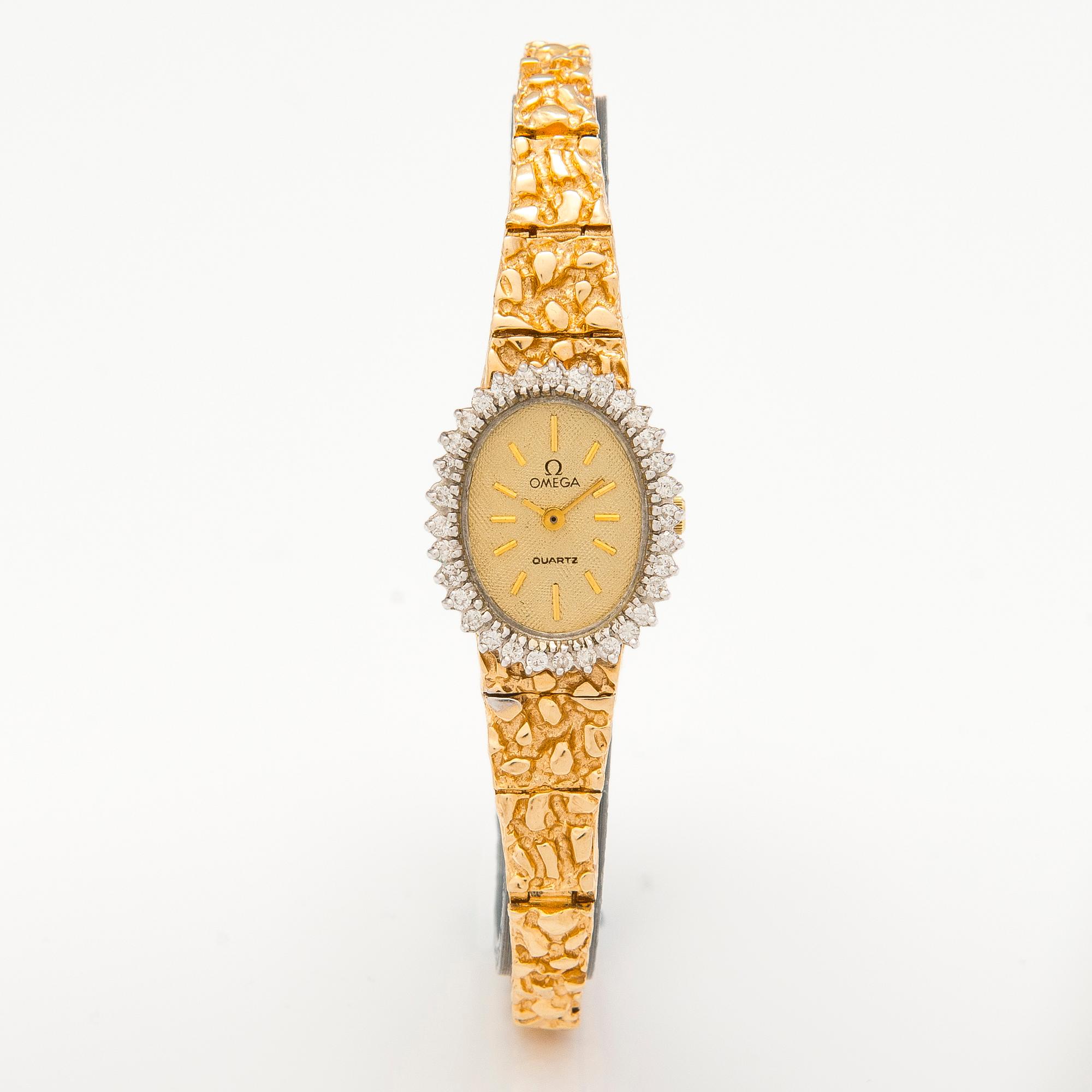 OMEGA, wrist watch, quartz, 14K gold, diamonds ca. 0.38 ct in total. 18 mm.