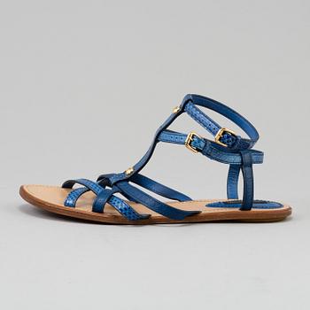 A pair of blue leather sandals by Louis Vuitton.