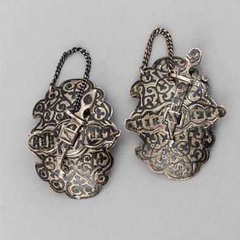 A Russian silver and niello bracelet and two belt buckles, unidentified makers mark, Kiev 1896-1908 and other.