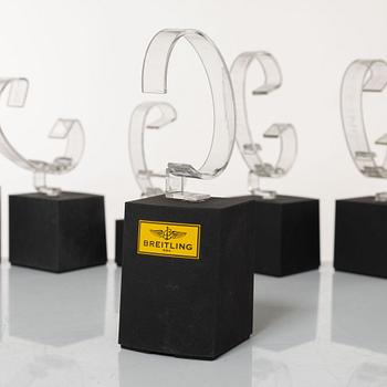Clock stands, 7 pcs, Breitling, TAG Heuer and Girard-Perregaux.