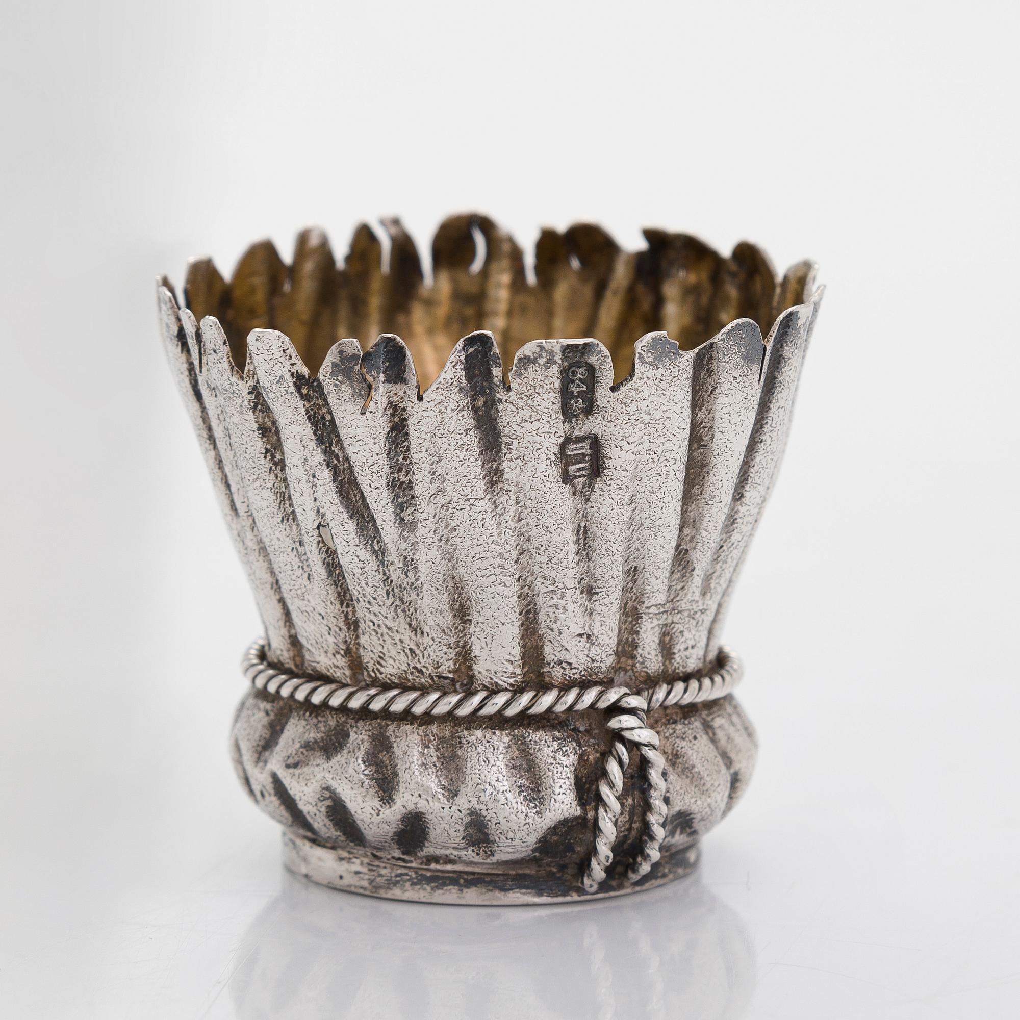 A silver and glass bottle with eight silver charka, maker marks of Pyotr Yermolajevich Davidov, Saint Petersburg, 1884.