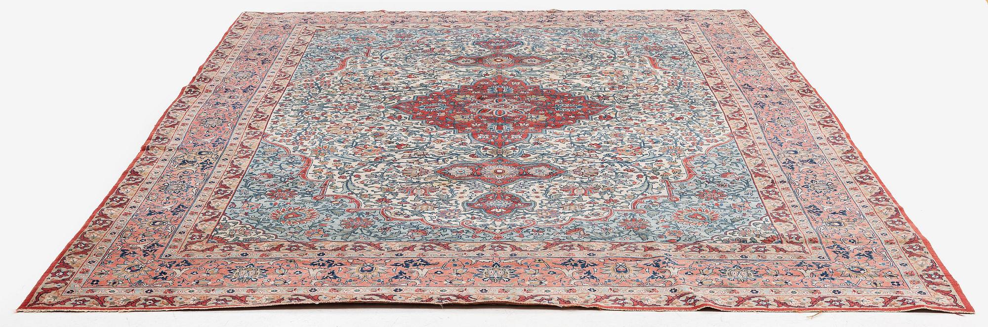 A semi-antique Qum carpet. Central Persia, c. 345 x 258 cm.
