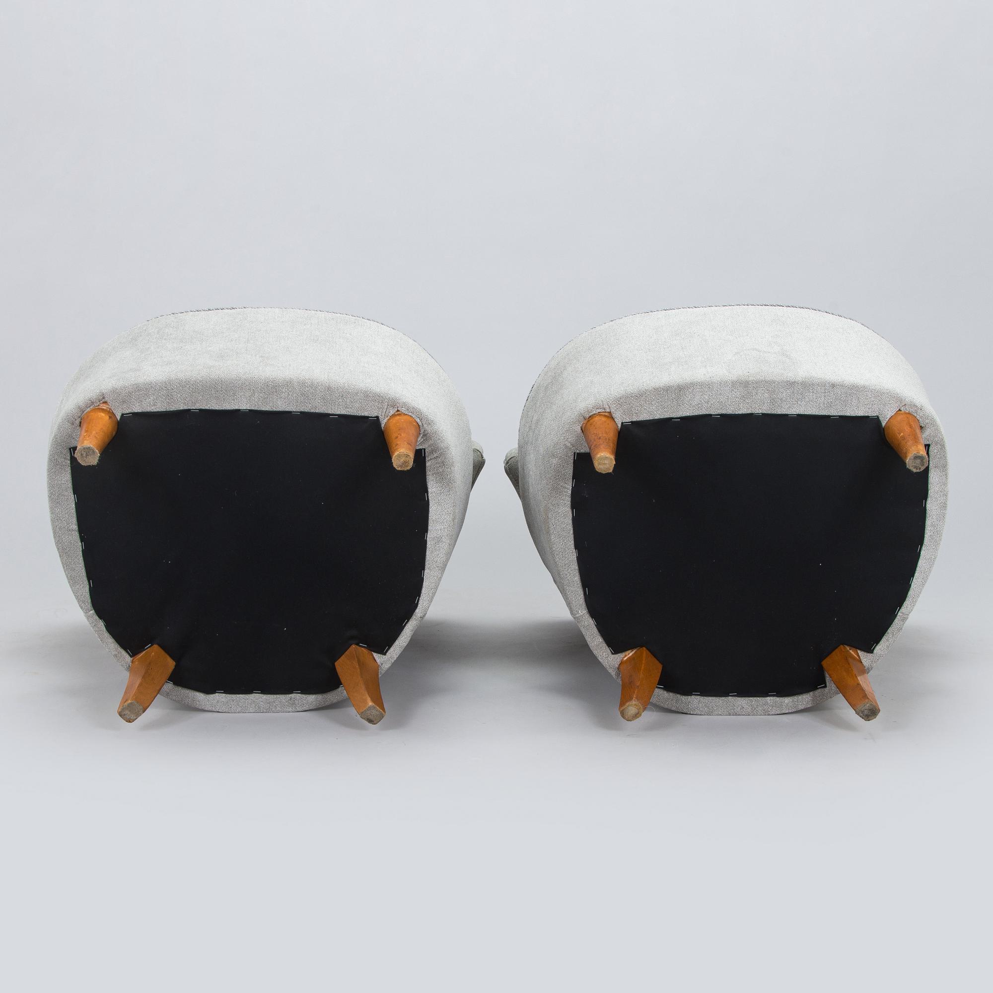 A pair of mid 20th century armchairs.