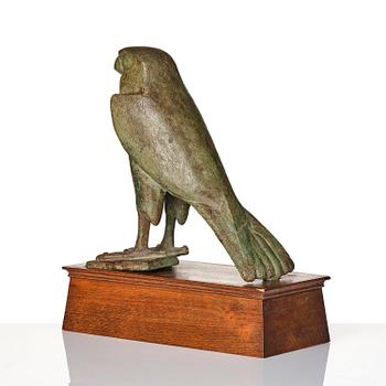 A fine and large Egyptian bronze figure of Horus the falcon, presumably late period Dynasty XXVI, (663-525 B.C.).