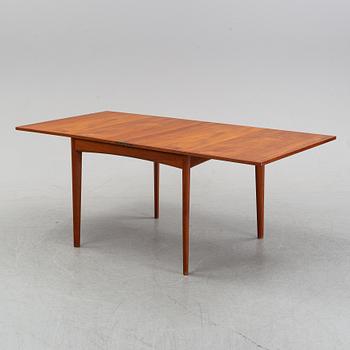 A teak dining group, table and six chairs model no. 49, designed by Erik Buch, Denmark, in 1949.