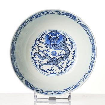 A blue and white four clawed dragon bowl, Qing dynasty with a four character mark of Xuantong (1909-11).