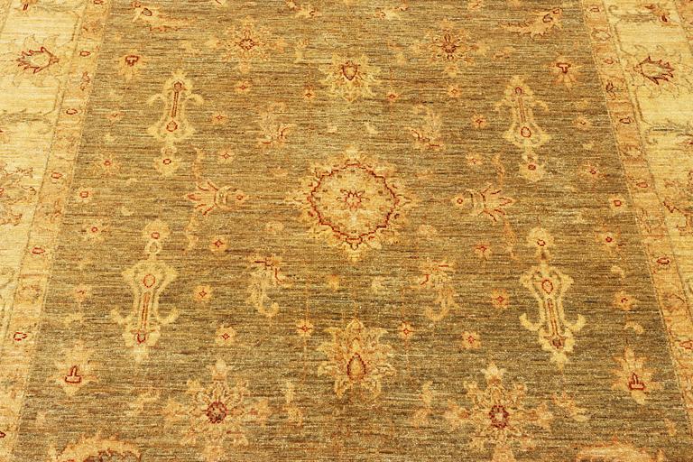 An Ushak rug, c. 244 x 167 cm.
