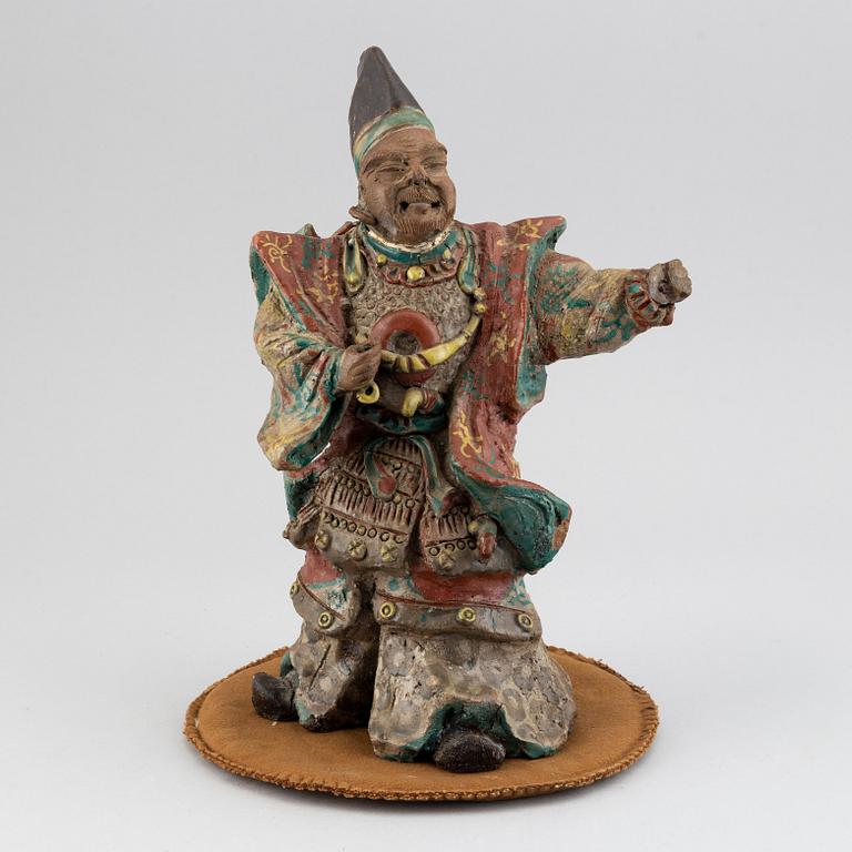 A Japanese pottery figure, 20th Century.