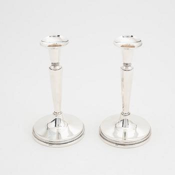 Eric Löfman, a pair of silver candlesticks, MGAB, Uppsala, 1976.